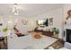 Cozy living room showcases a fireplace, TV, and neutral decor, perfect for relaxation at 2713 Serena Way, South Fulton, GA 30331