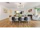 Open-concept living room is complete with fireplace and contemporary lighting at 2713 Serena Way, South Fulton, GA 30331