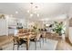 Open-concept living space featuring a dining area, kitchen, and comfortable seating arrangements at 2713 Serena Way, South Fulton, GA 30331