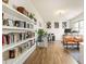 Home office features an array of shelving, natural light, and room to work or relax at 2713 Serena Way, South Fulton, GA 30331