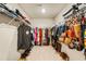 Walk-in closet with shelving and hanging clothes at 2713 Serena Way, South Fulton, GA 30331