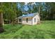 Cozy home with a blue metal roof, covered porch, and verdant lawn at 4200 E 166 Hwy, Carrollton, GA 30116