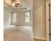 Bright bedroom boasting large windows, recessed lighting and comfortable carpeting at 711 Park Place Way, Social Circle, GA 30025