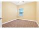 Bedroom with a ceiling fan, carpet, and a view of the outside from the window at 2147 Red Oak Cir, Union City, GA 30291