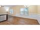 Bright dining area featuring stylish wainscoting, natural light, and wood-look flooring at 2147 Red Oak Cir, Union City, GA 30291