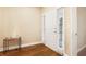 Bright entryway featuring wood floors, a side-lit front door, and a modern accent table at 2147 Red Oak Cir, Union City, GA 30291