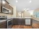 Modern kitchen features updated stainless steel appliances, attractive countertops, and a convenient breakfast bar at 2147 Red Oak Cir, Union City, GA 30291