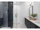 Modern bathroom featuring a walk-in shower with black tile and a stylish vanity with marble top at 2637 Mackintosh Ct # 8, Brookhaven, GA 30319