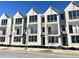 Modern townhome exterior featuring brick facade, balconies, and large windows for abundant natural light at 2637 Mackintosh Ct # 8, Brookhaven, GA 30319