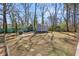 Expansive backyard with a small building and lush greenery, providing ample space for outdoor activities at 3180 Vine Cir, Decatur, GA 30033