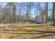 Large backyard featuring a shed and barbecue grill, perfect for outdoor gatherings and relaxation at 3180 Vine Cir, Decatur, GA 30033