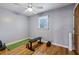 This bright bedroom features hardwood floors, neutral walls, and a ceiling fan for added comfort at 3180 Vine Cir, Decatur, GA 30033