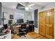 Bedroom with hardwood floors, a ceiling fan, and a large window for ample natural light at 3180 Vine Cir, Decatur, GA 30033