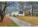 Single-story home featuring painted brick, modern windows, a blue front door and a well maintained front yard at 3180 Vine Cir, Decatur, GA 30033