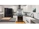 Modern kitchen featuring white cabinetry, subway tile backsplash, gray countertops and stainless steel appliances at 3180 Vine Cir, Decatur, GA 30033