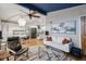 Inviting living room with a unique blue ceiling, modern furniture, hardwood floors, and plenty of natural light at 3180 Vine Cir, Decatur, GA 30033