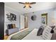 Well-lit bedroom featuring a ceiling fan and a decorative painting, offering a tranquil retreat at 343 8Th Street Ne # E2, Atlanta, GA 30309