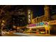 Night view of the illuminated Fox Theater showcasing architectural details and nearby city buildings at 343 8Th Street Ne # E2, Atlanta, GA 30309