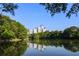 Scenic lake reflecting a skyline view with lush trees around, offering a serene environment in an urban setting at 343 8Th Street Ne # E2, Atlanta, GA 30309