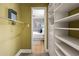 Functional walk-in closet providing plenty of shelving and storage solutions at 343 8Th Street Ne # E2, Atlanta, GA 30309