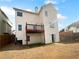 Backyard featuring a deck and a full view of the house's backside at 4441 Prather Son Dr, Loganville, GA 30052