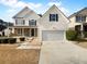 Charming two-story home with attached two-car garage and well-maintained landscaping at 4441 Prather Son Dr, Loganville, GA 30052