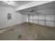 Spacious garage with concrete floor and a garage door at 4441 Prather Son Dr, Loganville, GA 30052