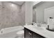 Cozy bathroom with tiled shower and dark wood vanity and updated fixtures at 545 Hanlon Way, Alpharetta, GA 30009