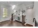 Welcoming foyer with hardwood floors, staircase, and stylish console table at 545 Hanlon Way, Alpharetta, GA 30009