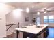 Kitchen island featuring a sink with pendant lights, and stairs nearby at 1430 Baygreen Rd, Suwanee, GA 30024