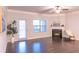 Open living room with hardwood floors, a fireplace, and access to a patio at 1430 Baygreen Rd, Suwanee, GA 30024