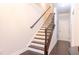 Staircase with hardwood steps and banister that lead to the upper level of the home at 1430 Baygreen Rd, Suwanee, GA 30024