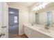 Bathroom with a double sink vanity, large mirror and neutral walls at 1521 Reids Ferry Way, Marietta, GA 30062