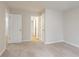 Cozy bedroom with neutral walls and carpet and white doors at 1521 Reids Ferry Way, Marietta, GA 30062