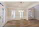 Bright dining area with wood floors, white trim, and a modern chandelier, perfect for Gathering dinners at 1521 Reids Ferry Way, Marietta, GA 30062