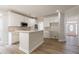 Modern kitchen with white cabinets, stainless steel appliances, and a center island for meal preparation at 1521 Reids Ferry Way, Marietta, GA 30062