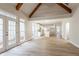 Open concept living space with a view of the kitchen, featuring abundant natural light and wood floors at 1521 Reids Ferry Way, Marietta, GA 30062