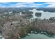 Lake Keowee aerial showcasing waterfront homes and docks amidst stunning natural beauty at 4110 Sinclair Shores Rd, Cumming, GA 30041