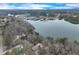 Aerial view of a lake community with boat docks nestled among the trees on Lake Keowee at 4110 Sinclair Shores Rd, Cumming, GA 30041