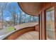 Exterior view from a curved wood deck with a view of a neighborhood and trees at 4110 Sinclair Shores Rd, Cumming, GA 30041