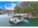 Large two story dock on the lake features a boat lift and jet ski parking with lakeside views at 4110 Sinclair Shores Rd, Cumming, GA 30041