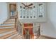 Bright foyer with hardwood stairs, a large window, wood front door and banister at 4110 Sinclair Shores Rd, Cumming, GA 30041