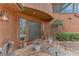 Inviting front entrance with double doors and brickwork path, surrounded by lush greenery and mature trees at 4110 Sinclair Shores Rd, Cumming, GA 30041