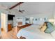 Bright main bedroom with vaulted ceiling, wood floors, neutral walls, ceiling fan, and french doors at 4110 Sinclair Shores Rd, Cumming, GA 30041