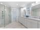 Bright and airy bathroom featuring a glass-enclosed shower, double vanity, and modern fixtures at 4230 N Elizabeth Se Ln, Atlanta, GA 30339