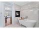 Elegant bathroom with a soaking tub, fireplace, and modern fixtures at 4230 N Elizabeth Se Ln, Atlanta, GA 30339