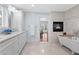 Luxurious bathroom with a soaking tub, fireplace, marble countertops and elegant fixtures at 4230 N Elizabeth Se Ln, Atlanta, GA 30339