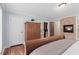 Bedroom showcasing a large armoire, a walk-in closet, and a cozy fireplace at 4230 N Elizabeth Se Ln, Atlanta, GA 30339