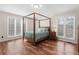 Spacious bedroom with four poster bed, natural light and hard wood floors at 4230 N Elizabeth Se Ln, Atlanta, GA 30339