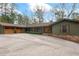 Charming single-story home showcasing a spacious driveway and two-car garage at 4230 N Elizabeth Se Ln, Atlanta, GA 30339